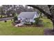 Quaint cottage with manicured landscaping and driveway at 4156 Mcintosh Rd, Dover, FL 33527