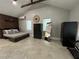 Cozy bedroom with wood-paneled accent wall and ample closet space at 4156 Mcintosh Rd, Dover, FL 33527