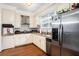 Well-equipped kitchen boasts stainless steel appliances and ample counter space at 4156 Mcintosh Rd, Dover, FL 33527