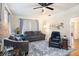 Living room with hardwood floors, gray sofas, and a ceiling fan at 4156 Mcintosh Rd, Dover, FL 33527