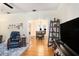 Living room with view into dining area and hardwood floors at 4156 Mcintosh Rd, Dover, FL 33527