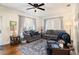 Spacious living room with hardwood floors and comfy seating at 4156 Mcintosh Rd, Dover, FL 33527