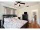 Main bedroom with King bed, hardwood floors, and ceiling fan at 4156 Mcintosh Rd, Dover, FL 33527