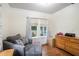 Home office features hardwood floors, built-in shelving and large windows at 4156 Mcintosh Rd, Dover, FL 33527