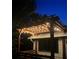 Relaxing pergola with string lights, creating an outdoor oasis at 4156 Mcintosh Rd, Dover, FL 33527