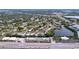 Aerial view of waterfront community showing building, canal, and surrounding neighborhood at 4455 Duhme Rd # 303, St Petersburg, FL 33708