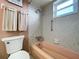 Clean bathroom with pink bathtub and shower at 4455 Duhme Rd # 303, St Petersburg, FL 33708