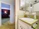 Guest bathroom with vanity and a view into bedroom at 4455 Duhme Rd # 303, St Petersburg, FL 33708