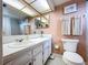 Bathroom with shower, bathtub, and updated vanity at 4455 Duhme Rd # 303, St Petersburg, FL 33708