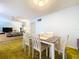 Bright dining area with a table and chairs, adjacent to the living room at 4455 Duhme Rd # 303, St Petersburg, FL 33708