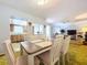 Dining room with kitchen view, features a table and chairs at 4455 Duhme Rd # 303, St Petersburg, FL 33708