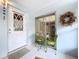 Small entryway with white door and patio seating at 4455 Duhme Rd # 303, St Petersburg, FL 33708