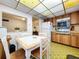 Kitchen with wood cabinets, white appliances, and a built-in microwave at 4455 Duhme Rd # 303, St Petersburg, FL 33708