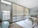 Living room with wicker furniture and access to balcony at 4455 Duhme Rd # 303, St Petersburg, FL 33708