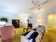 Living room with green shag carpet, sofa, and armchair at 4455 Duhme Rd # 303, St Petersburg, FL 33708