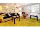 Living room with green shag carpet, sofa, and armchair at 4455 Duhme Rd # 303, St Petersburg, FL 33708