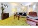Living room with green shag carpet, sofa, and armchair at 4455 Duhme Rd # 303, St Petersburg, FL 33708