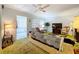 Living room with green shag carpet, sofa, and rocking chair at 4455 Duhme Rd # 303, St Petersburg, FL 33708