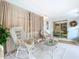 Relaxing sunroom with wicker furniture and access to outside at 4455 Duhme Rd # 303, St Petersburg, FL 33708