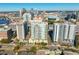 Aerial view of a luxury condo building with city skyline and amenities at 450 Knights Run Ave # 705, Tampa, FL 33602