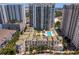 Aerial view highlighting a highrise residential building with adjacent amenities at 450 Knights Run Ave # 705, Tampa, FL 33602