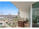Private balcony with city views and comfortable seating area at 450 Knights Run Ave # 705, Tampa, FL 33602