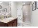 Condo bathroom with shower and seashell mirror at 450 Knights Run Ave # 705, Tampa, FL 33602
