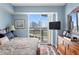 Bright bedroom with city view, dresser, and comfortable bed at 450 Knights Run Ave # 705, Tampa, FL 33602