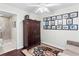Condo bedroom with wood floors and built-in storage at 450 Knights Run Ave # 705, Tampa, FL 33602