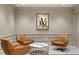 Common area with three brown leather armchairs at 450 Knights Run Ave # 705, Tampa, FL 33602