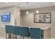 Modern community bar with teal barstools at 450 Knights Run Ave # 705, Tampa, FL 33602