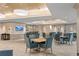 Spacious community room with tables and chairs at 450 Knights Run Ave # 705, Tampa, FL 33602