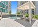 Relaxing hot tub with shaded seating area at 450 Knights Run Ave # 705, Tampa, FL 33602