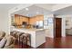 Modern kitchen with light wood cabinets and breakfast bar at 450 Knights Run Ave # 705, Tampa, FL 33602