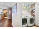 Well-equipped laundry room with washer, dryer, and ample storage shelving at 450 Knights Run Ave # 705, Tampa, FL 33602