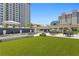 Expansive green lawn with outdoor seating and tables at 450 Knights Run Ave # 705, Tampa, FL 33602