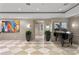 Elegant lobby with grand piano, artwork, and plants at 450 Knights Run Ave # 705, Tampa, FL 33602