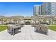 Outdoor patio with seating areas and a built-in grill at 450 Knights Run Ave # 705, Tampa, FL 33602