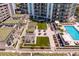 Resort-style pool and deck area with ample lounge chairs and shade structures at 450 Knights Run Ave # 705, Tampa, FL 33602