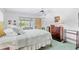 Bright bedroom with brass bed frame, dresser, and water views at 4500 38Th S St, St Petersburg, FL 33711