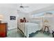 Bedroom with brass bed frame, green carpet, and ample natural light at 4500 38Th S St, St Petersburg, FL 33711