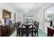 Elegant dining room with a large table, chandelier, and water views at 4500 38Th S St, St Petersburg, FL 33711