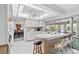 Bright kitchen with white cabinets, breakfast bar, and water views at 4500 38Th S St, St Petersburg, FL 33711