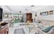 Living room features canal view, comfortable seating, and a bar area at 4500 38Th S St, St Petersburg, FL 33711