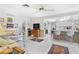 Open concept living room and kitchen with tiled floors and a bar area at 4500 38Th S St, St Petersburg, FL 33711