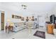 Spacious living area with a sectional sofa and a view into the kitchen at 4500 38Th S St, St Petersburg, FL 33711