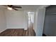 Bedroom with wood-look floors, a window, and a door to another room at 4939 Docner St, New Port Richey, FL 34652