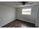 Bedroom with wood-look floors and a window at 4939 Docner St, New Port Richey, FL 34652