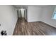 Long hallway with wood-look floors leading to other rooms at 4939 Docner St, New Port Richey, FL 34652