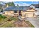 Housetop view of single-story home with driveway and landscaping at 4940 Cardinal Trl, Palm Harbor, FL 34683